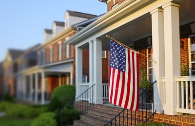 United States flag on the front porch of a home. 